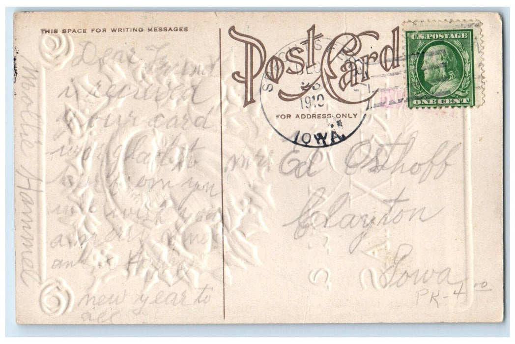 1910 Christmas Santa Claus In Holly Berries Wreath Embossed Clayton IA Postcard