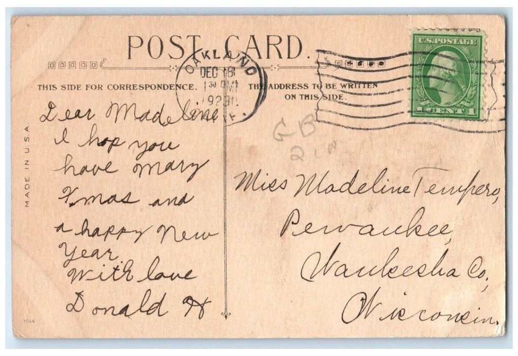 1928 Merry Christmas Little Boy With Gifts And Holly Berries Oakland CA Postcard