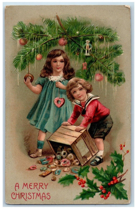 c1910's Christmas Tree Boy Girl Decorating Holly Berries Embossed Postcard