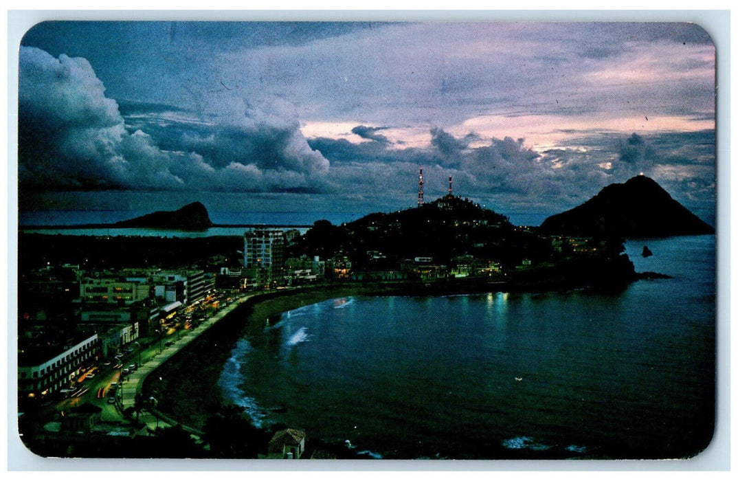 1976 Twilight Settles Over Mazatlan's Olas Altas Mexico Postcard