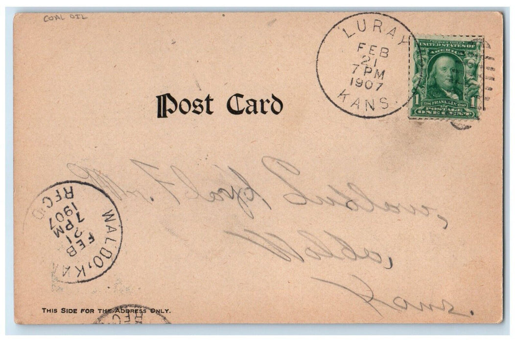 1907 Man De Lighted Fire D Large Number Coal Oil Luray Kansas KS Posted Postcard