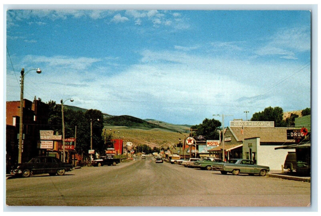 c1960's Main Street View Motel Drug Store Cars Dubois Wyoming WY Postcard