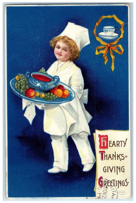 1910 Thanksgiving Greetings Boy Chef Serving Fruits Embossed Clapsaddle Postcard