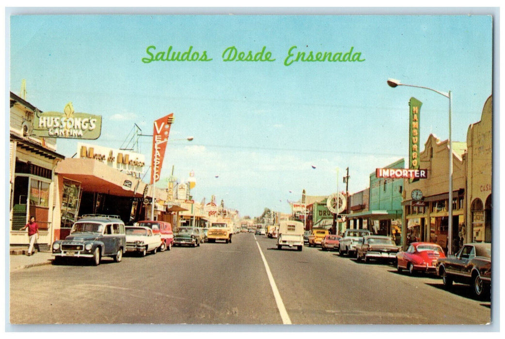 c1950's Velasco Importer Saludos Desde Ensenada Main Street Mexico Postcard