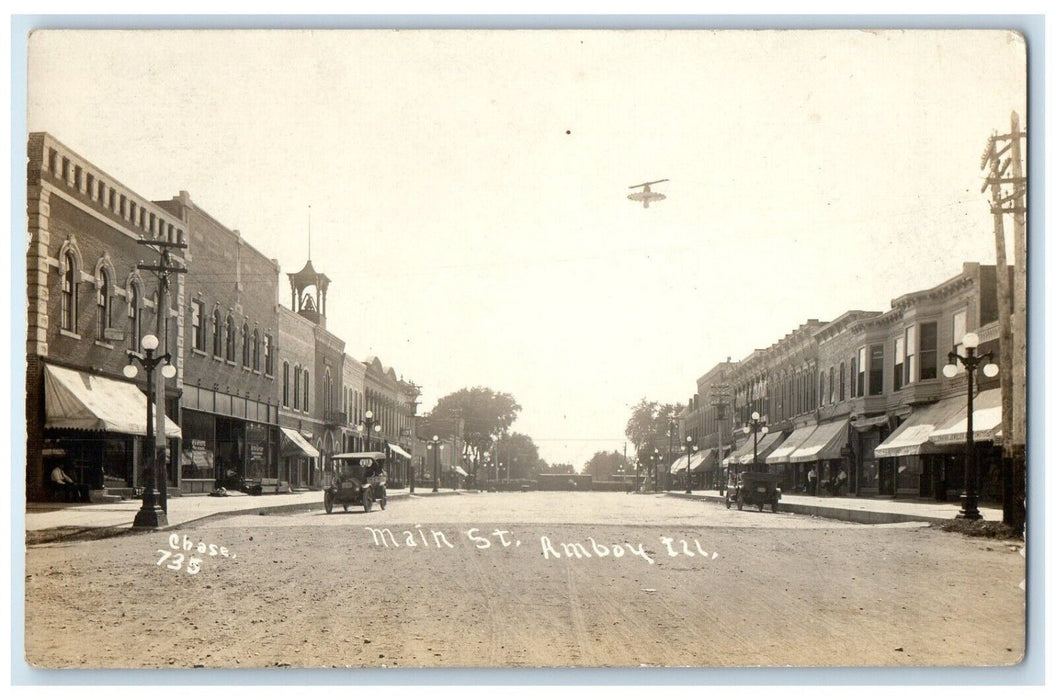 c1910's Main Street Cars Stores Dirt Road Amboy Illinois IL RPPC Photo Postcard