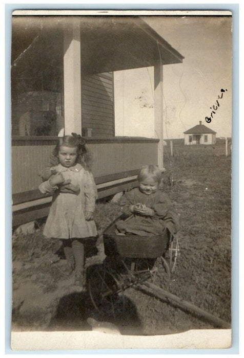 1908 Children Girl Teddy Bear Wagon Gregory South Dakota SD RPPC Photo Postcard