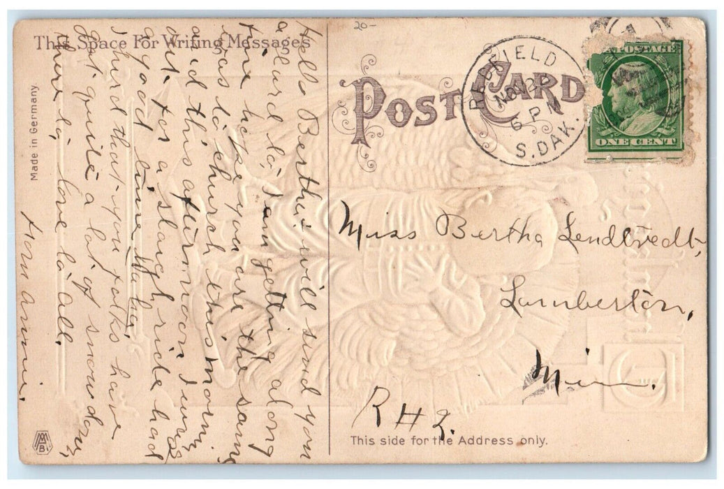 1909 Thanksgiving Boy And Turkey Hatchet Embossed Redfield SD Antique Postcard