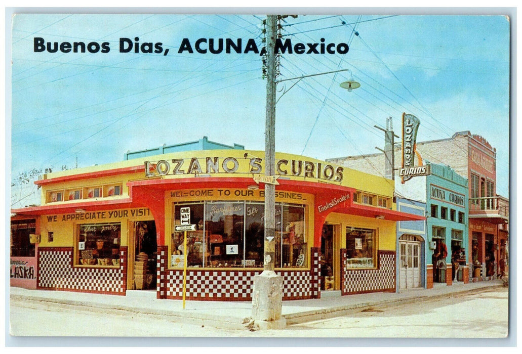 c1950s Lozano's Curios Business Section Buenos Dias Ciudad Acuna Mexico Postcard