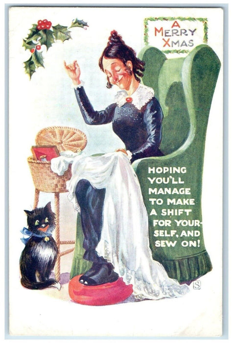 c1910's Christmas Old Woman Stitching Cat Holly Berries Posted Antique Postcard