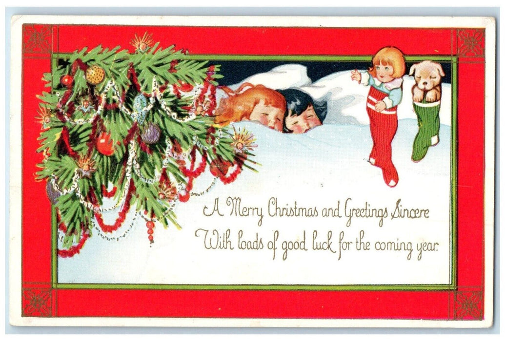 c1910s Christmas Greetings Children Sleeping Toys In Stockings Embossed Postcard
