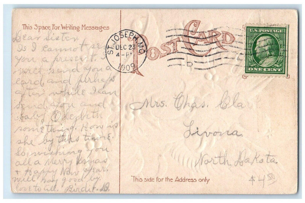 1909 Christmas Angel Ringing Bell Holly Berries Mistletoe Embossed Postcard