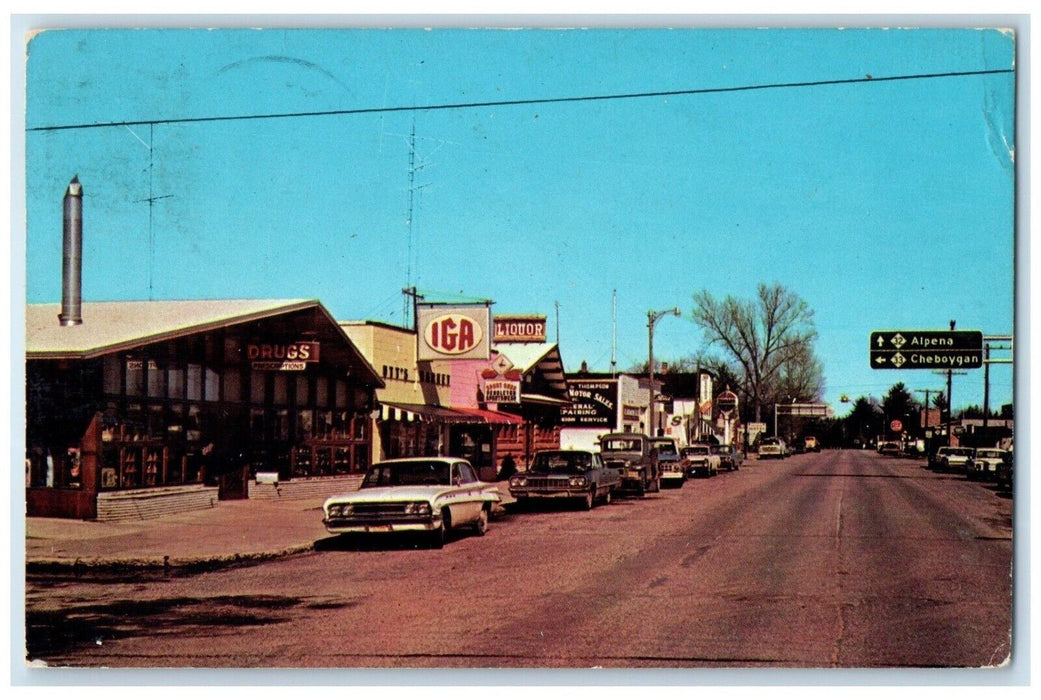 1969 Street Scene Classic Cars Road Buildings Atlanta Michigan Vintage Postcard