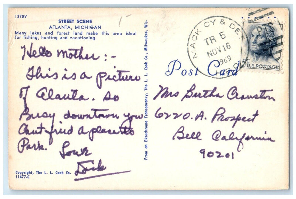 1969 Street Scene Classic Cars Road Buildings Atlanta Michigan Vintage Postcard