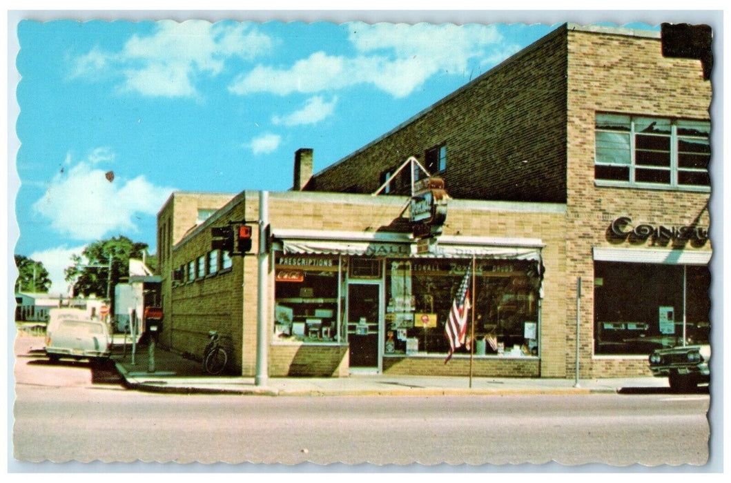 c1960 Leonall Drug Building North Main Street Cheboygan River Michigan Postcard