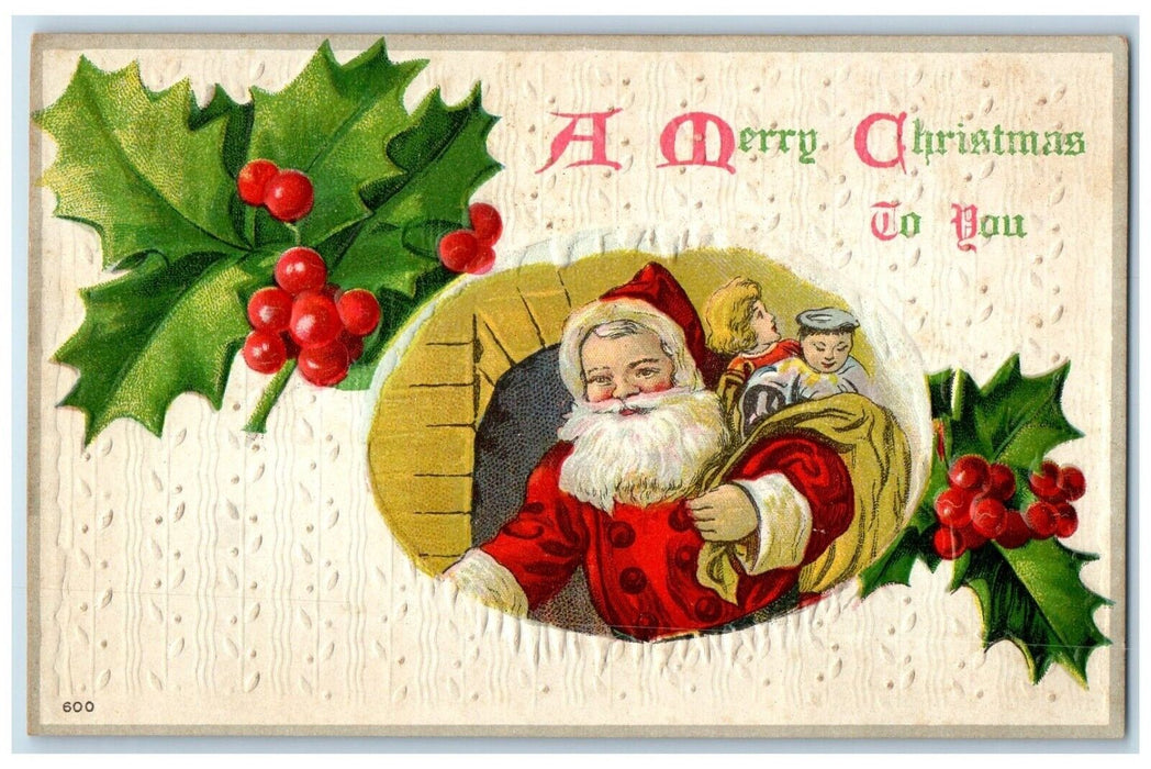 c1910s Christmas Santa Claus Sack Of Toys Holly Berries Embossed Posted Postcard