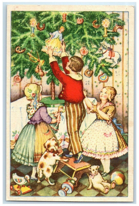 c1910's Christmas Tree Children Decorating Dolls Candle Lights Antique Postcard