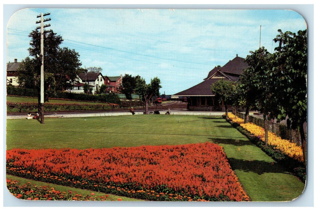 1954 The CPR Station and Beautiful Flower Gardens Kenora Canada Postcard