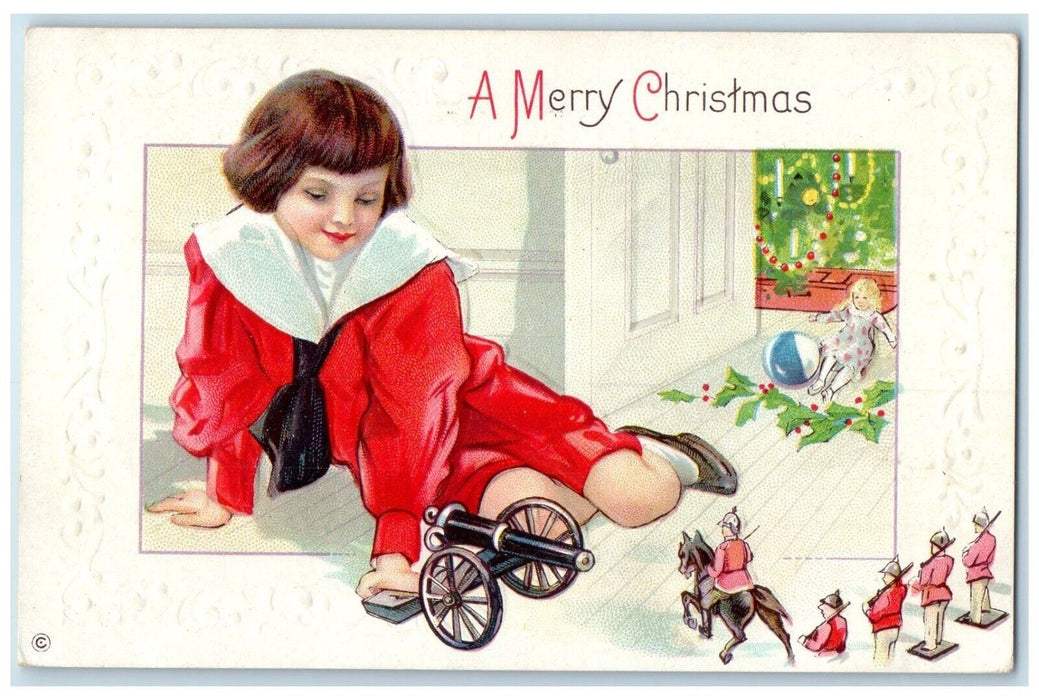 c1910's Christmas Boy Playing Cannon Toys Holly Berries Embossed Posted Postcard