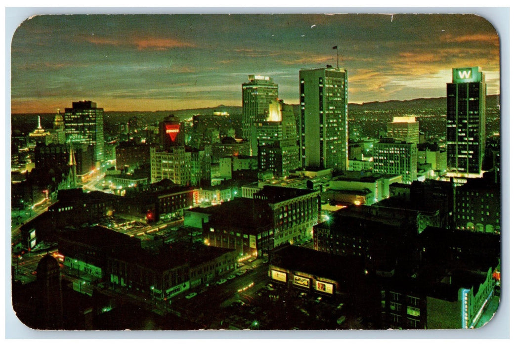 1965 Panorama Down Town Denver At Night Skyscrapers Buildings Street CO Postcard