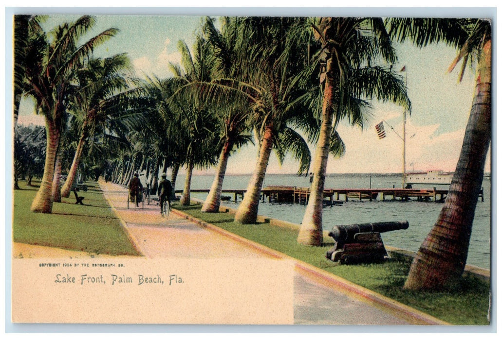 c1905 Lake Front Cannon Lined Trees Wharf Boat Bicycles Palm Beach FL Postcard