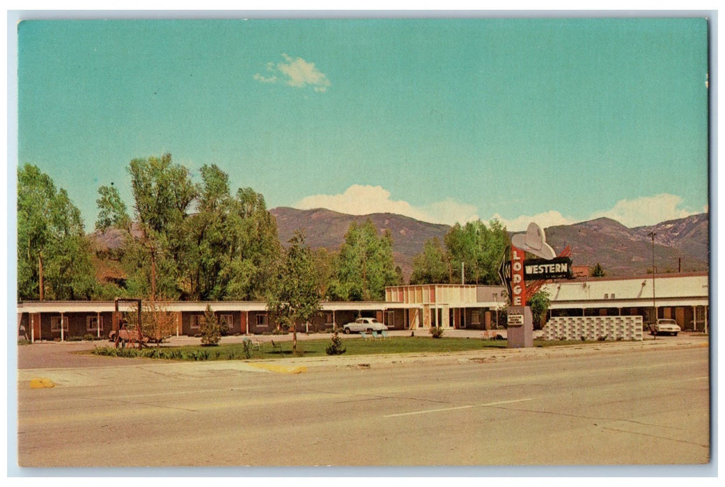 c1960s Western Lodge Roadside Steamboat Springs Colorado CO Posted Tree Postcard