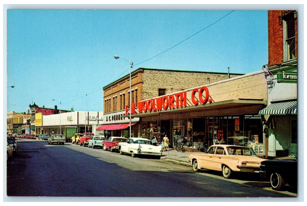 c1950's Downtown Stores Bicycles Classic Cars Road Manistee Michigan MI Postcard