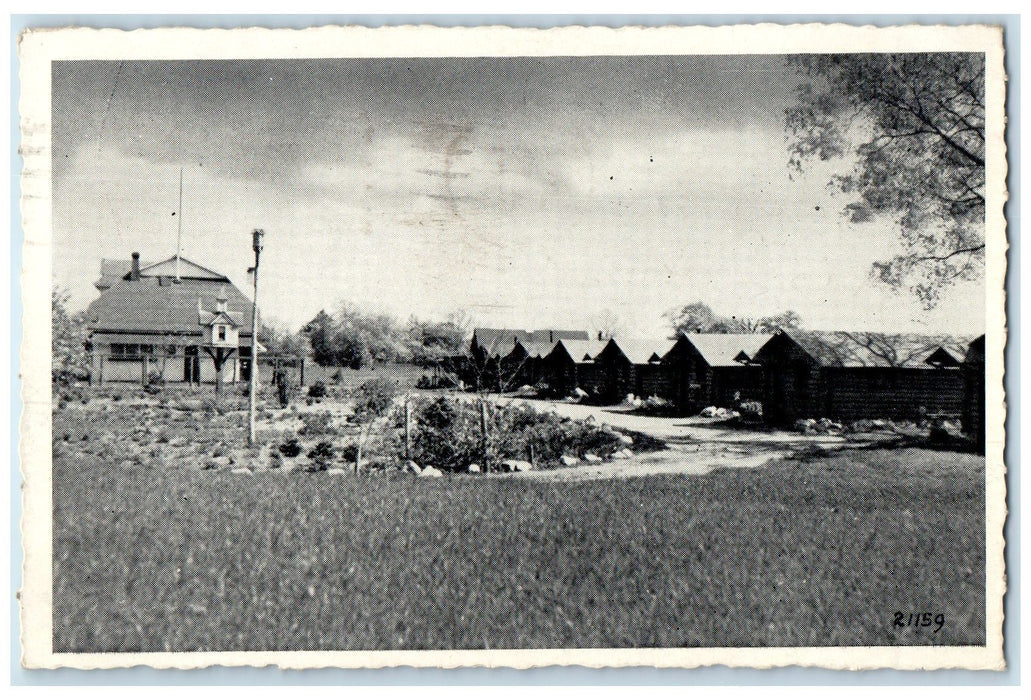 1948 Lake Shore Lodge Furnished Log Cabins Bathing Beach Ludington MI Postcard