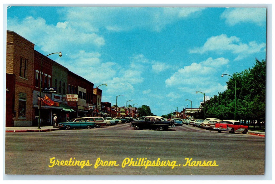 c1960's Greetings From Philipsburg 3rd Street Main Block Business KS Postcard