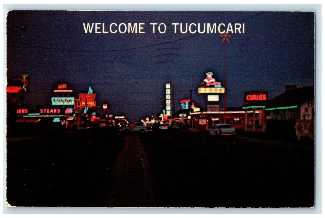 1976 Welcome Sunset Over Night Lights Downtown Tucumcari New Mexico NM Postcard