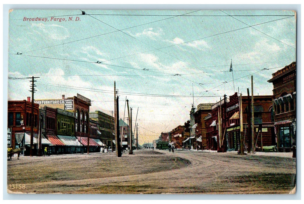 1909 Broadway Dirt Road Bicycle Trolley Buildings Fargo North Dakota Postcard